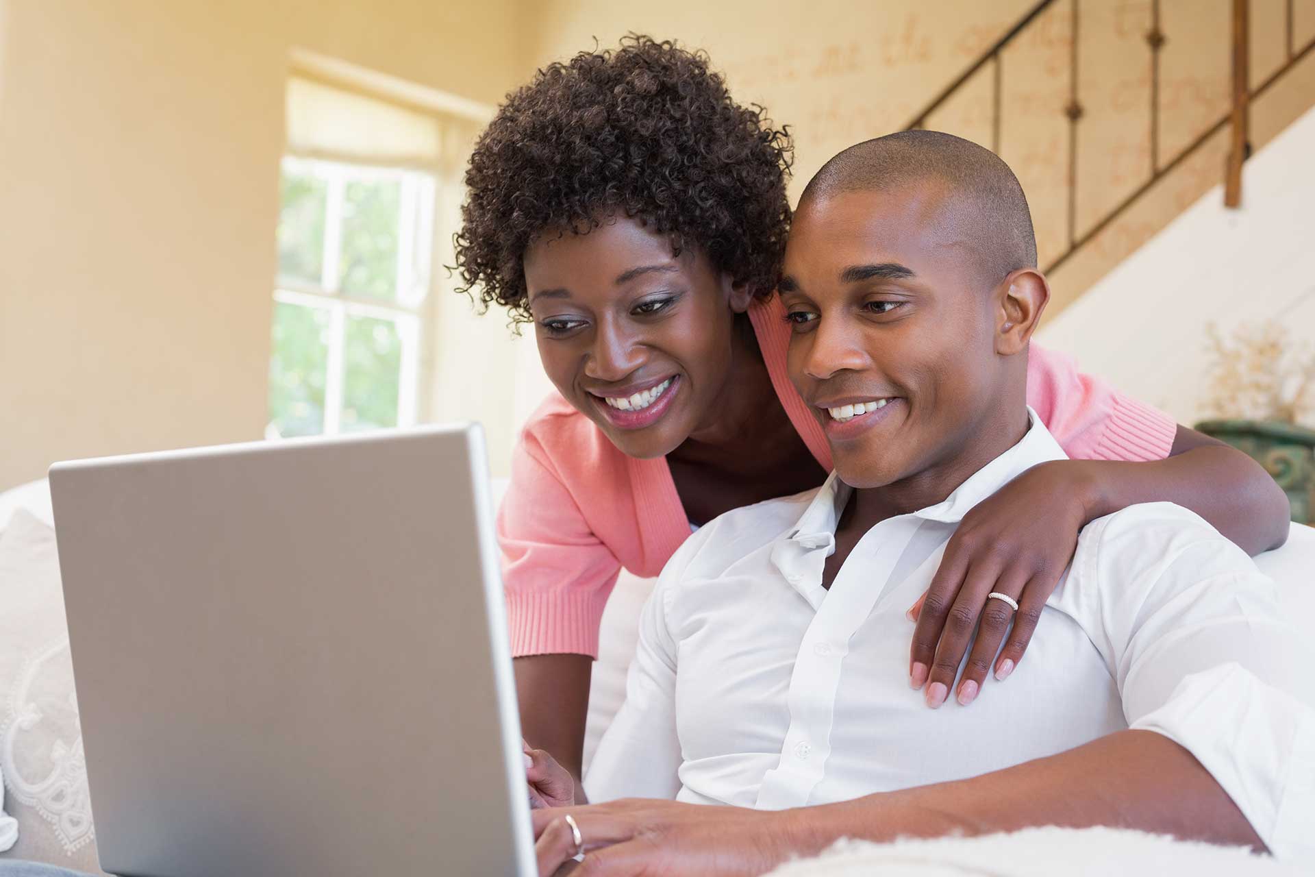 couple in front of laptop