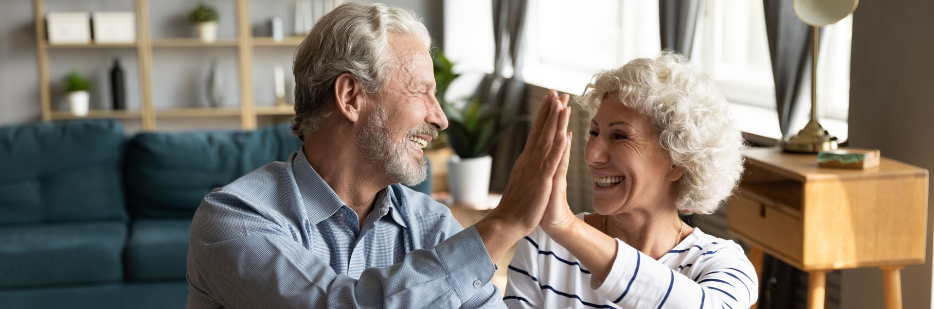 couple hi-fiving over taxes