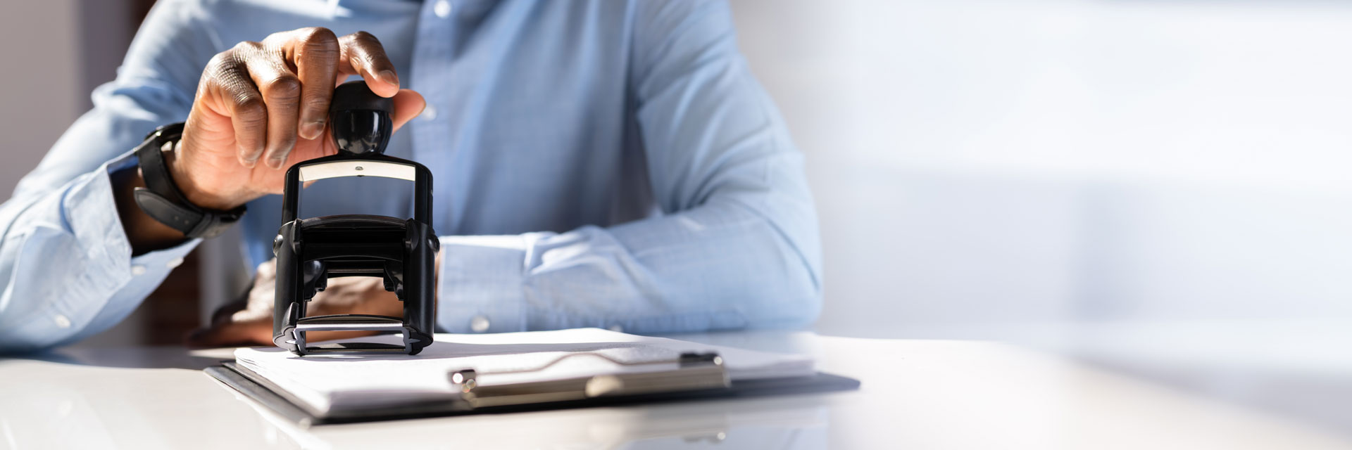accountant using a date stamp