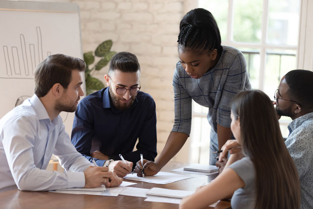 accountant instructing group in a conference room
